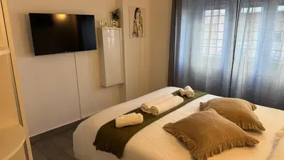 a bedroom with a bed with two towels on it at Angoletto di Mirtilla in Rome