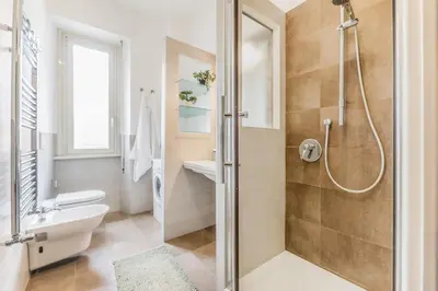 a bathroom with a shower and a toilet and a sink at Wonderful Garden at Colosseo in Rome