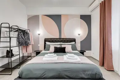 a bedroom with a large bed with two towels on it at BDC - Mariposa 3BDR in San Giovanni in Rome