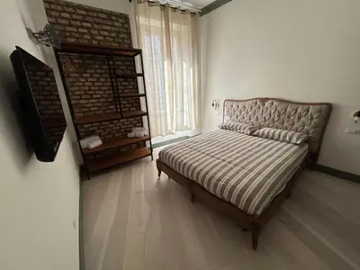 a bedroom with a bed and a stair case at Home Domus Castel Sant'Angelo in Rome