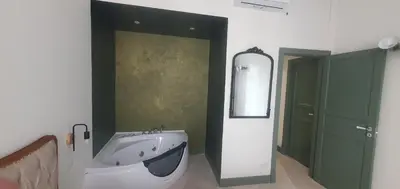 a bathroom with a large sink and a mirror at Home Domus Castel Sant'Angelo in Rome