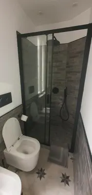 a bathroom with a toilet and a shower at Home Domus Castel Sant'Angelo in Rome