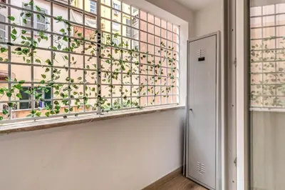 a room with a window with a plant at Maison Carrozze in Rome