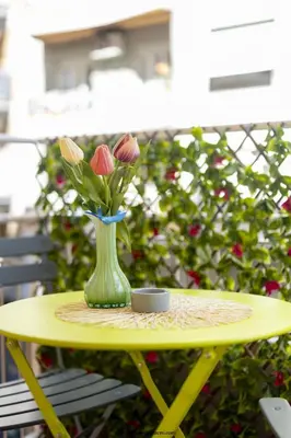 a vase of flowers sitting on a table at cinquepuntozero in Rome