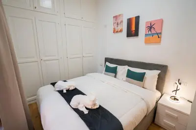 two stuffed animals are sitting on a bed at Valenziani Luxury Central Rome in Rome