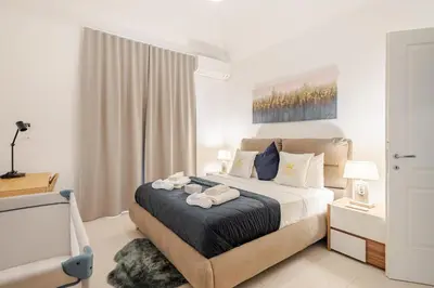 a bedroom with a bed with two towels on it at Aurelian Crown Central Rome in Rome