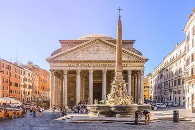a building with a fountain in the middle of a street at Aurelian Crown Central Rome in Rome