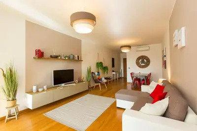 a living room with a couch and a tv at Boutique Domus Trastevere Family in Rome
