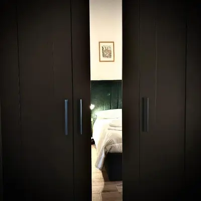 a door leading to a bedroom with a bed at Casa Campani 56 in Rome