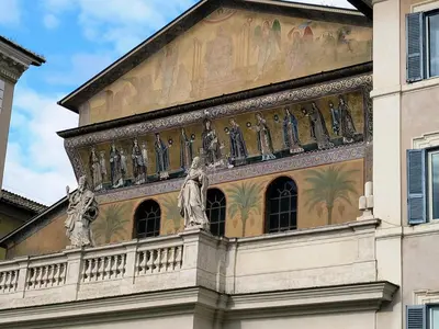 a building with statues on the side of it at ERA Trastevere in Rome