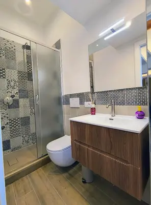 a bathroom with a sink and a shower and a toilet at ERA Trastevere in Rome