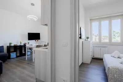 a kitchen with a table and a dining room at Your dream in Rome San Paolo in Rome