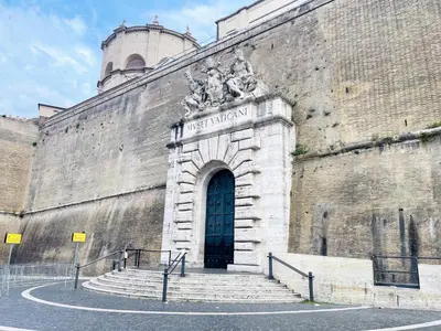 a large brick building with a door and stairs at GG Vatican Townhouse in Rome