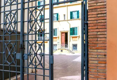 an empty street in a city with buildings at Ospiti di Jole al Pigneto in Rome