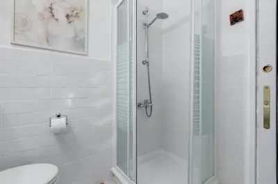 a bathroom with a glass shower with a toilet at Casa Marino Roma in Rome