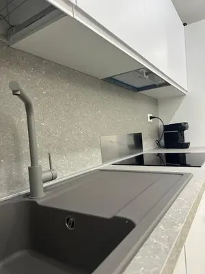 a kitchen with a sink and a counter top at Star Suite Rome in Rome