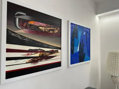 two framed photographs hanging on a wall in a room at Star Suite Rome in Rome