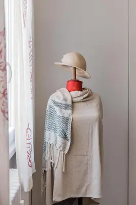 a mannequin wearing a hat and a blanket at Dreamy Loft by the Opera Theater in Rome