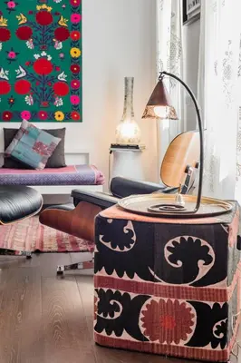 a living room with a table and a lamp at Dreamy Loft by the Opera Theater in Rome