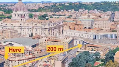 an aerial view of a city with a sign that says here at Domus San Pietro - Elegant stay in Vatican in Rome