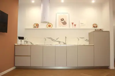 a counter in a room with a marble counter top at Domus San Pietro - Elegant stay in Vatican in Rome
