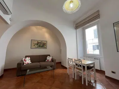 a living room with a couch and a table at Paolina lovely apartment in Rome