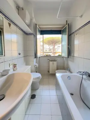 a bathroom with two sinks and a tub and a toilet at Casa Anna Vaticano in Rome