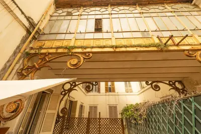 an entrance to a building with a balcony at Barberini Grand Retreat with Terrace in Rome