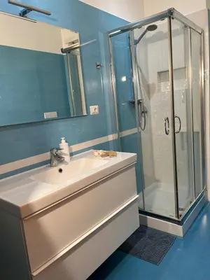 a bathroom with a sink and a shower at Cris House Monteverde in Rome