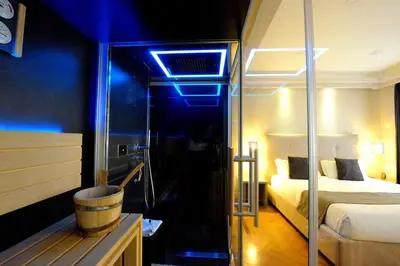 a hotel room with a bed and a blue light at Terrazza Marco Antonio Luxury Suite in Rome