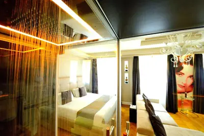 a bedroom with a bed and a glass wall at Terrazza Marco Antonio Luxury Suite in Rome
