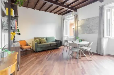 a living room with a couch and a table at Fienaroli in Trastevere in Rome