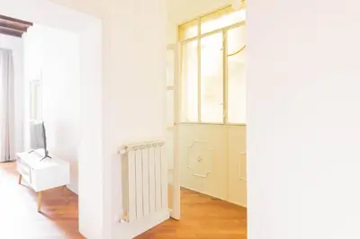 a living room with a radiator and a window at Fienaroli in Trastevere in Rome
