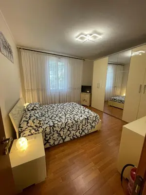 a bedroom with a bed and a large mirror at Eternal Lemon Home in Rome
