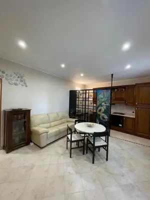 a living room with a couch and a table at Eternal Lemon Home in Rome