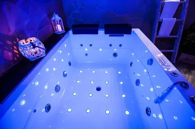 a white bath tub in a room with a lamp at Mancini Shabby House in Rome