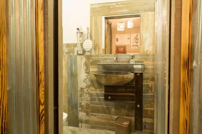 a bathroom with a sink and a mirror at Mancini Shabby House in Rome