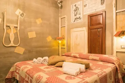 a bedroom with two beds with towels on it at Mancini Shabby House in Rome