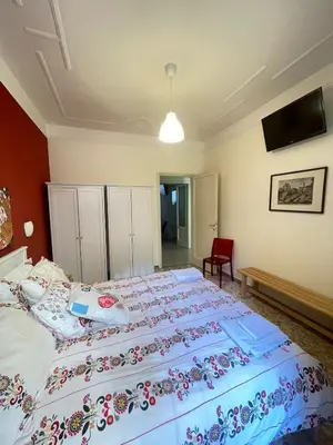 a bedroom with a large bed in a room at Celio west side apartment in Rome