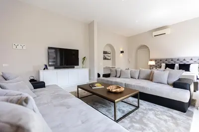 a living room with two couches and a tv at Amazing Colosseo in Rome
