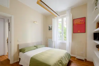 a bedroom with a bed and a window at Botanical Home close Vatican in Rome
