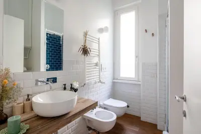 a bathroom with a tub and a toilet and a sink at Botanical Home close Vatican in Rome