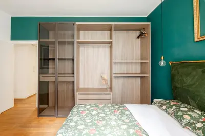 a bedroom with a built in book shelf and a bed at Botanical Home close Vatican in Rome