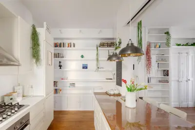 a kitchen with white walls and a counter top at Botanical Home close Vatican in Rome