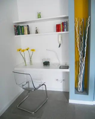 a white desk with a chair and some books at Saint Peter's House in Rome