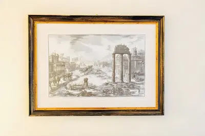 a framed drawing of a city with a monument at Elegantis Milos Suite Apartment - Your Chic Retreat in Central Rome in Rome