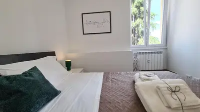 a bedroom with a bed with two towels on it at LoveRhome Apartment 14 in Rome