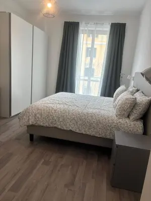 a bedroom with a bed and a window at PORTA FURBA Suites in Rome