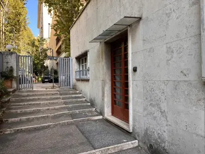 a door on the side of a building with stairs at Holiday home Roma Night and Day in Rome