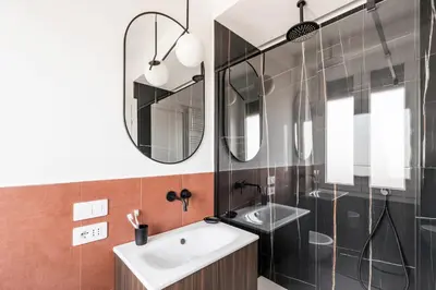 a bathroom with a sink and a shower at The Best Rent - Spacious three-bedroom flat in the San Giovanni area in Rome